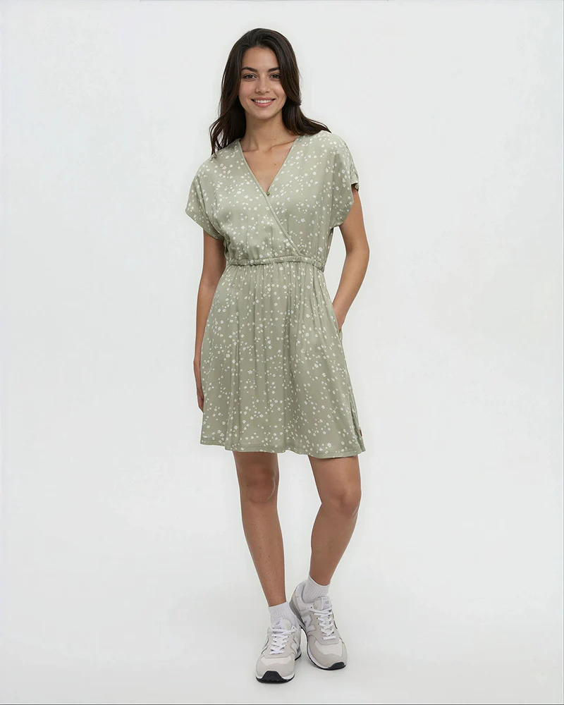 Short-sleeve wrap dress in sage green with white floral pattern, worn by model