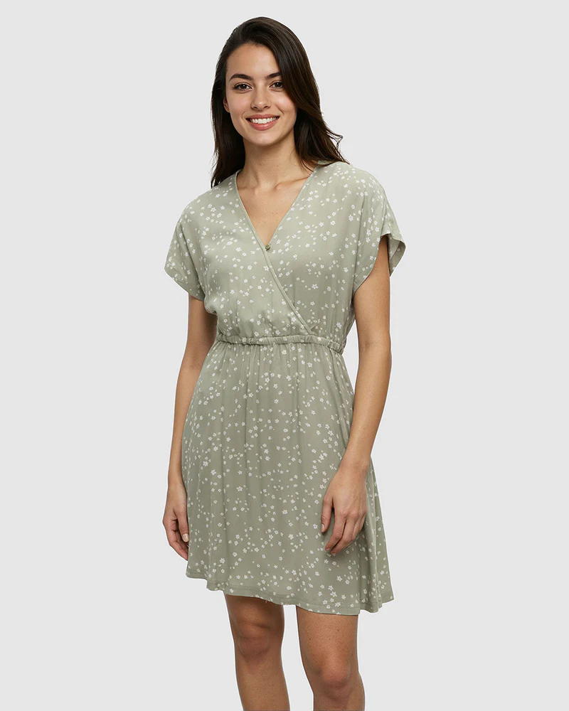 Light green wrap dress with small white floral pattern and short sleeves