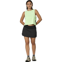 Women's black athletic skort with built-in shorts, front view on model
