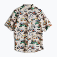 Short sleeve button-up shirt with outdoor adventure print on light background, front view