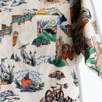 Button-up shirt with outdoor adventure print showing camping scenes, animals, and recreational activities