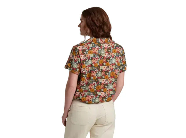 Women's short sleeve button-up shirt with dark floral print, shown from back view