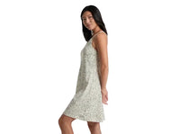 Women's sleeveless midi dress with paisley print pattern, side view on model
