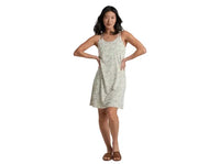 Sleeveless mini dress with small floral print and crossback straps, modeled on woman