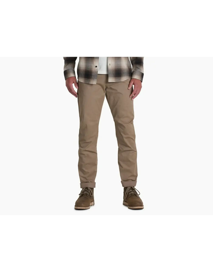 Men's slim-fit khaki chino pants with cuffed hem, front view on model