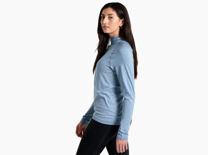 Light blue long-sleeve pullover with quarter-zip and mock neck, worn by model