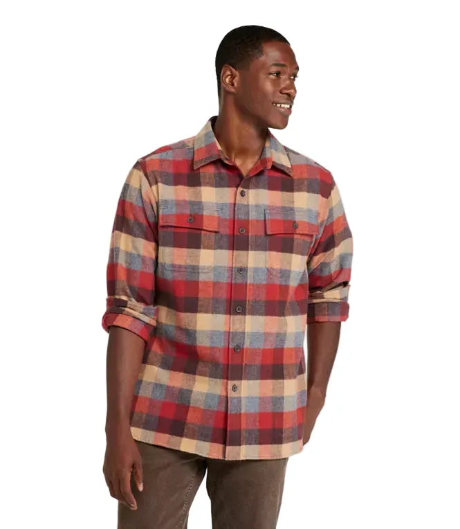 Men's plaid flannel shirt with chest pockets and rolled sleeves, front view on model