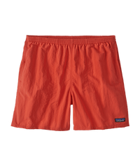 Bright orange-red athletic shorts with elastic waistband and small logo patch, front view