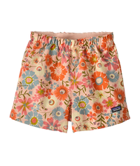 Toddler shorts with elastic waistband featuring vibrant floral print on peachy background