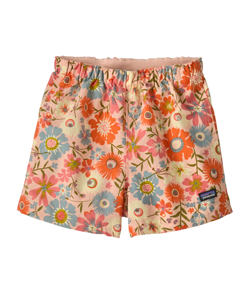 Toddler shorts with elastic waistband featuring vibrant floral print on peachy background