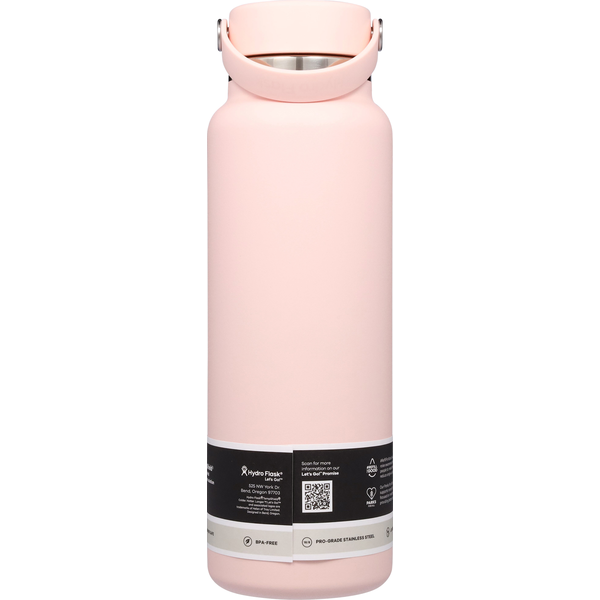 Light pink insulated wide-mouth water bottle with flex cap handle, back view showing product label