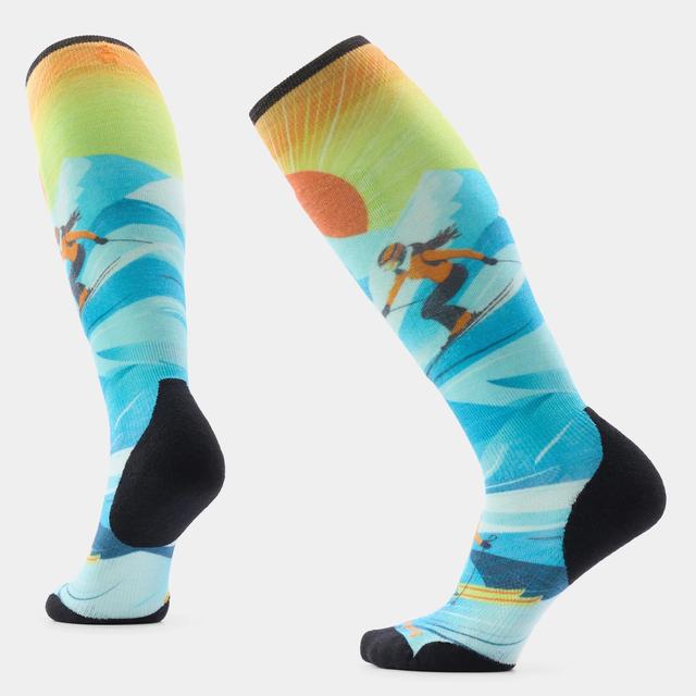 Knee-high ski socks with colorful skier graphic, blue background, and black heel and toe