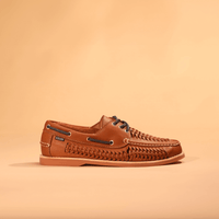 Brown leather boat shoe with woven pattern detail and lace-up closure, side profile view
