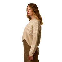 Women's fairisle knit pullover sweater in beige tones, side view, paired with olive skirt