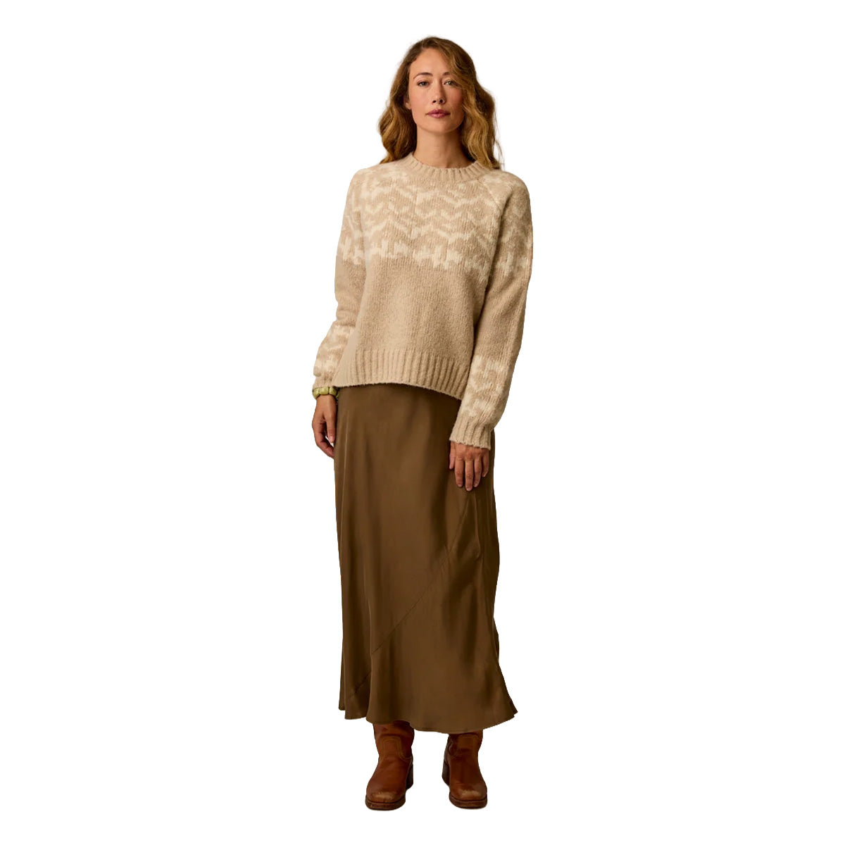 Women's cream fairisle crewneck sweater with geometric pattern, worn with olive maxi skirt, front view