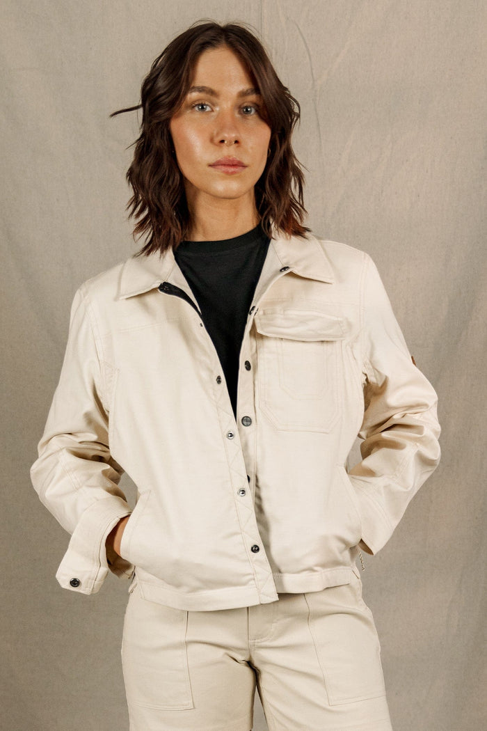 Women's button-front shirt jacket in cream, worn over black tee, front view