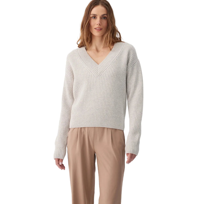 Women's v-neck chunky knit sweater in off-white, long sleeves, relaxed fit, front view