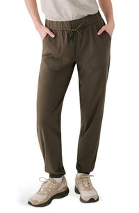 Olive green jogger pants with drawstring waist and side pockets, worn with sneakers