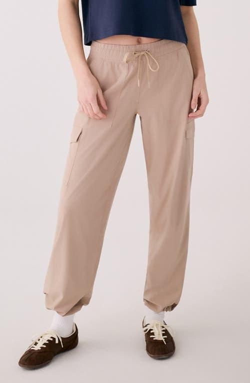 Beige cargo pants with drawstring waist and side pockets on model