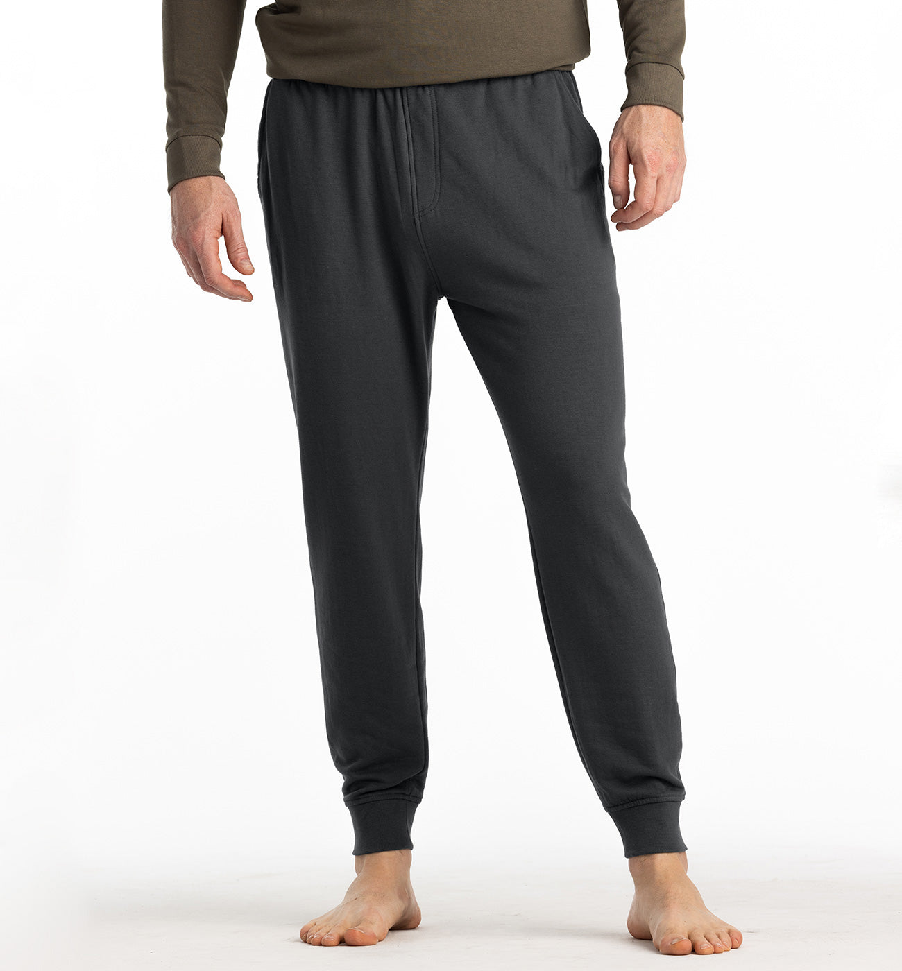 Men's lightweight fleece jogger pants in dark charcoal, front view with ribbed cuffs and elastic waistband