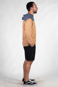 Men's color-blocked hooded sun shirt with hood up, shown in profile view
