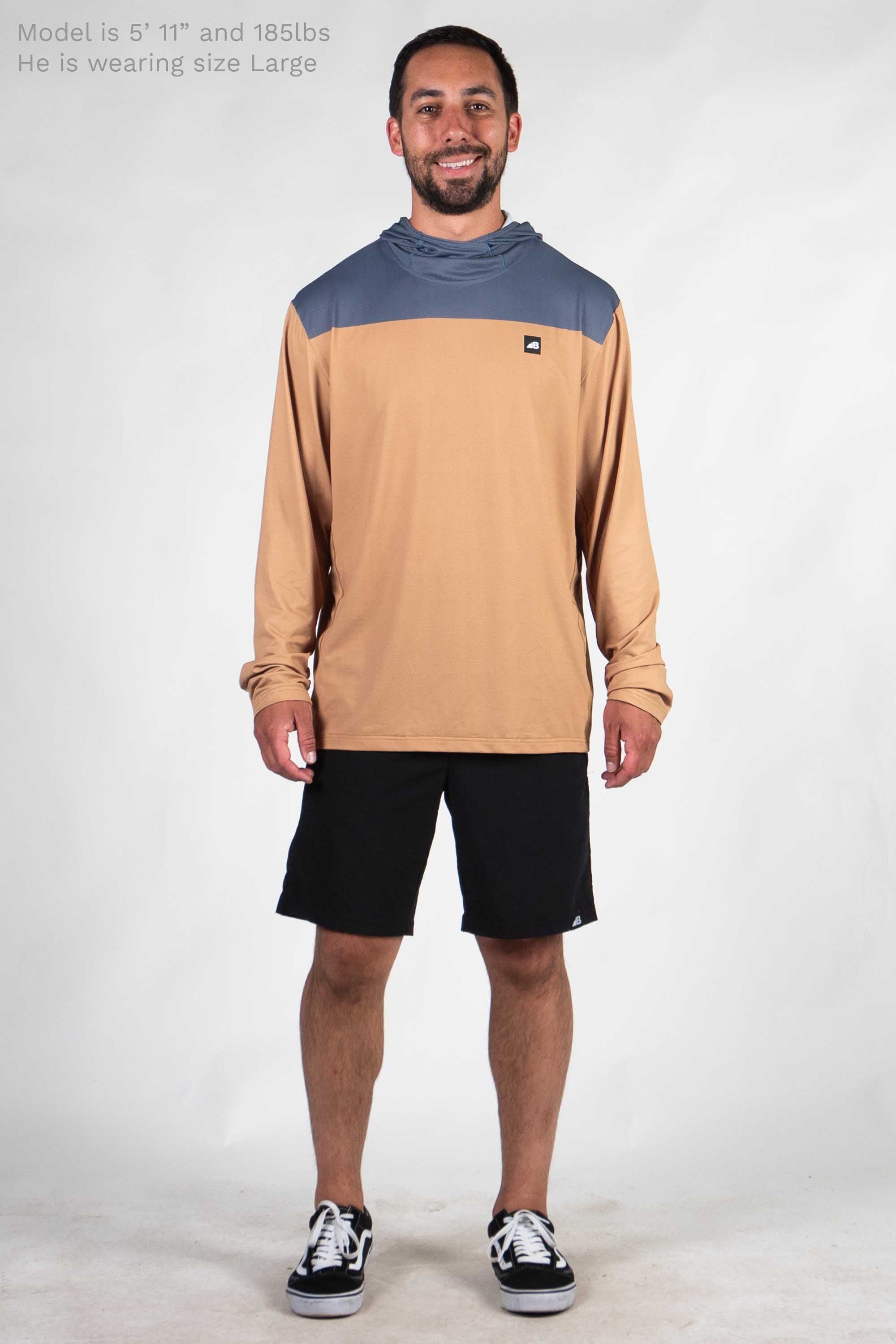 Men's long sleeve hooded shirt with brown body and blue shoulder panel on model