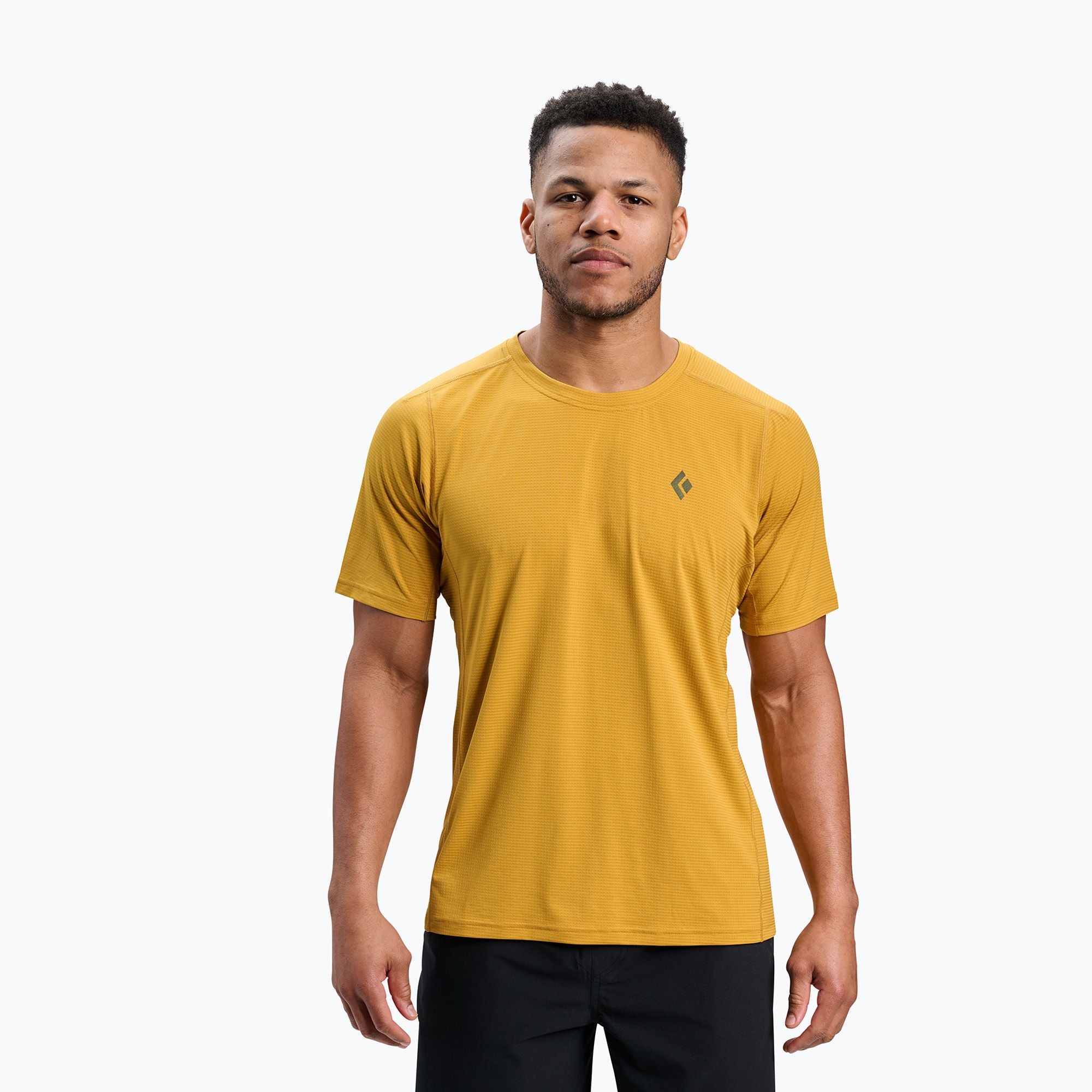 Golden yellow short sleeve technical t-shirt with crew neck, front view on model