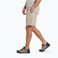 Light beige shorts with side pockets shown on model in walking pose
