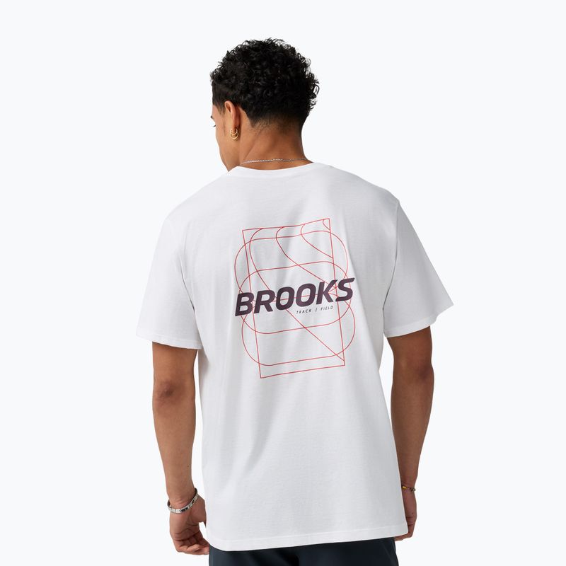 Men's white graphic t-shirt with geometric track field back print, rear view on model