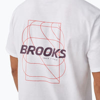 White graphic t-shirt back view showing geometric lines and bold brand text with track and field text
