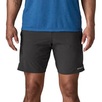 Black athletic shorts worn by man, front view showing mid-thigh length and fitted waistband