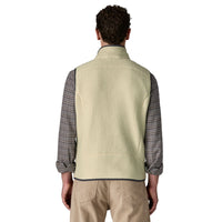 Men's fleece vest in cream with dark trim, back view, worn over plaid shirt
