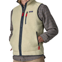 Men's sherpa fleece vest with full zip, chest pocket, and navy trim, front angle view