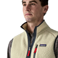 Men's sherpa fleece vest with full zip, navy trim, and red zipper pulls, close-up front view