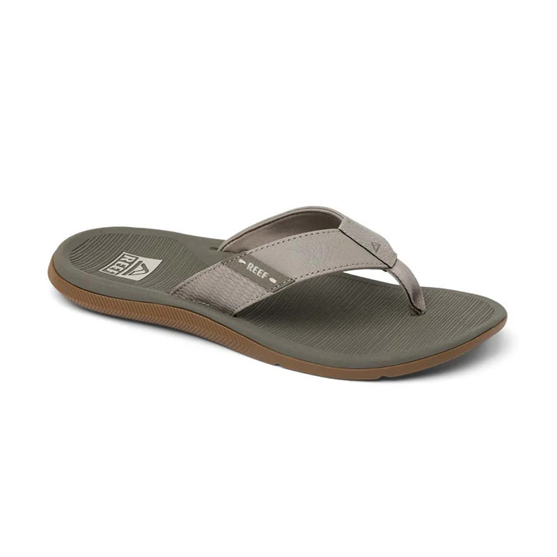 Men's flip flop sandal with textured olive footbed, tan fabric straps, and brown rubber sole