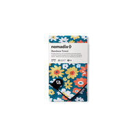 Packaged bandana towel with vibrant floral pattern featuring daisies and flowers on teal background