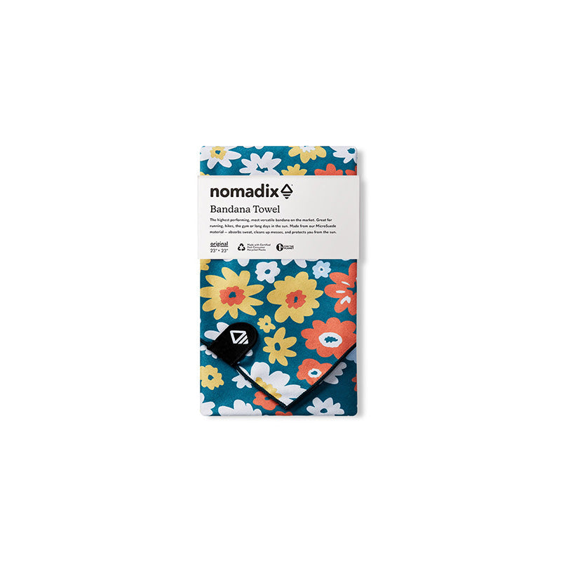 Packaged bandana towel with vibrant floral pattern featuring daisies and flowers on teal background