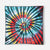 Square bandana towel with vibrant tie-dye spiral pattern in multiple colors, displayed flat against white background