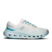 Women's running shoe with white mesh upper, chunky light blue midsole with cutout pods, and teal laces