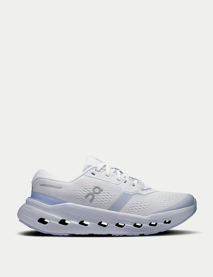Women's running shoe in white and light blue, side profile view with CloudTec sole