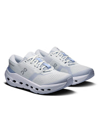 Women's running shoes in white and light blue, three-quarter view, chunky cloud sole