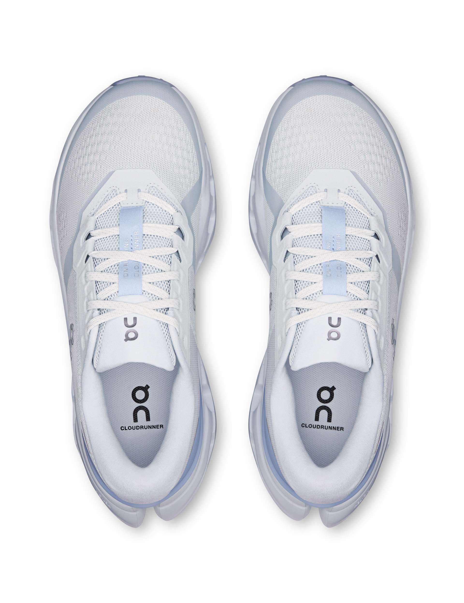 Top-down view of a pair of white and light blue running shoes with mesh upper