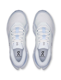 Top-down view of a pair of white and light blue running shoes with mesh upper