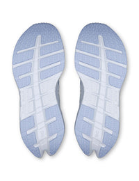 Bottom view of a pair of women's running shoes showing light blue outsole with hexagonal tread pattern