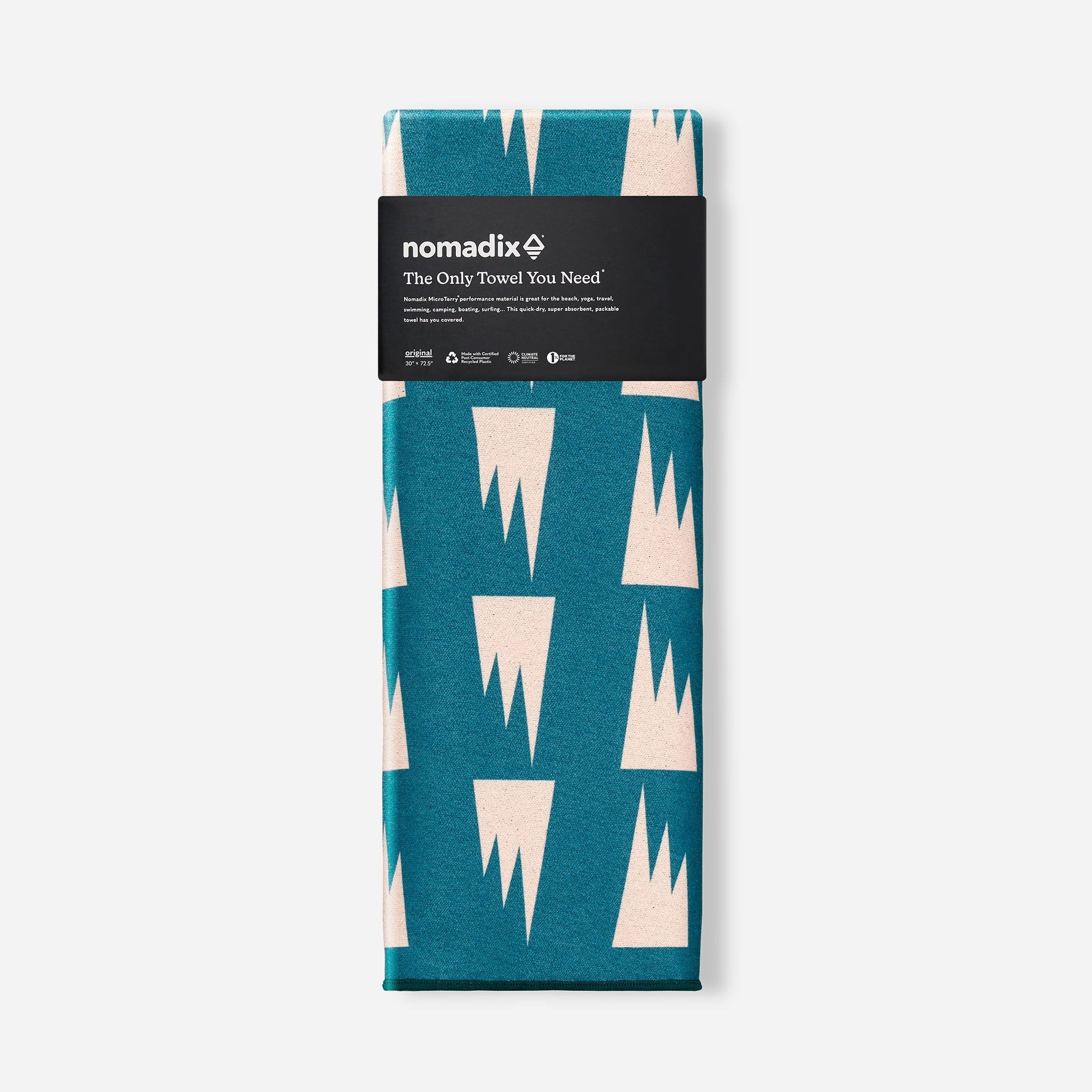 Folded travel towel with teal and cream geometric triangle pattern in retail packaging