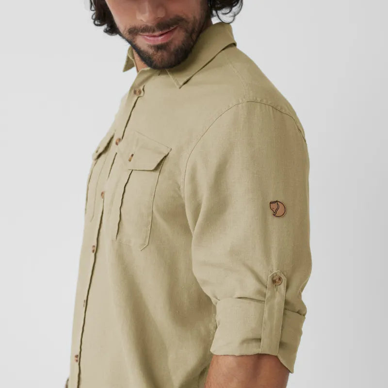 Khaki long-sleeve button-up shirt with chest pockets and roll-up sleeves, three-quarter view