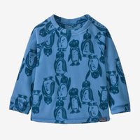 Blue fleece crew neck pullover with penguin print pattern, front view