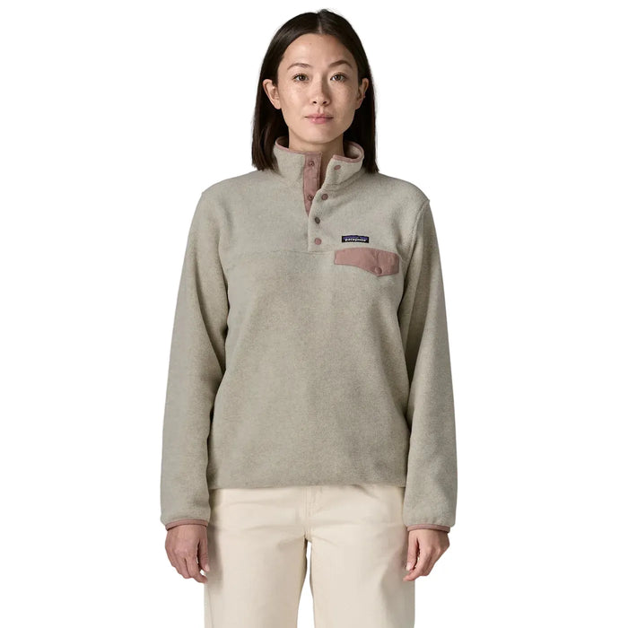 Women's fleece pullover with snap-button collar, chest pocket, and long sleeves, front view