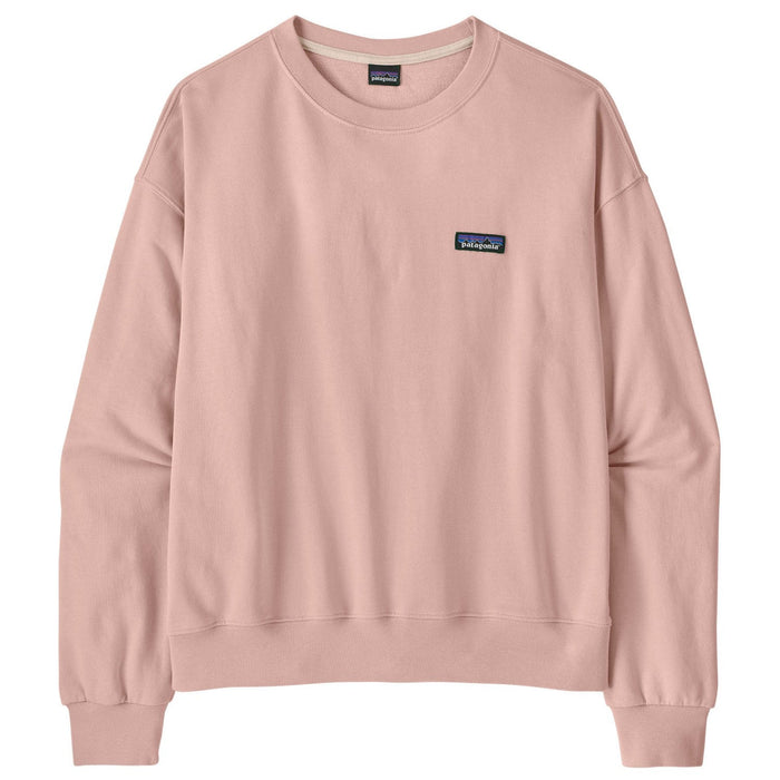 Soft pink crewneck sweatshirt with ribbed cuffs and hem, small logo patch on chest