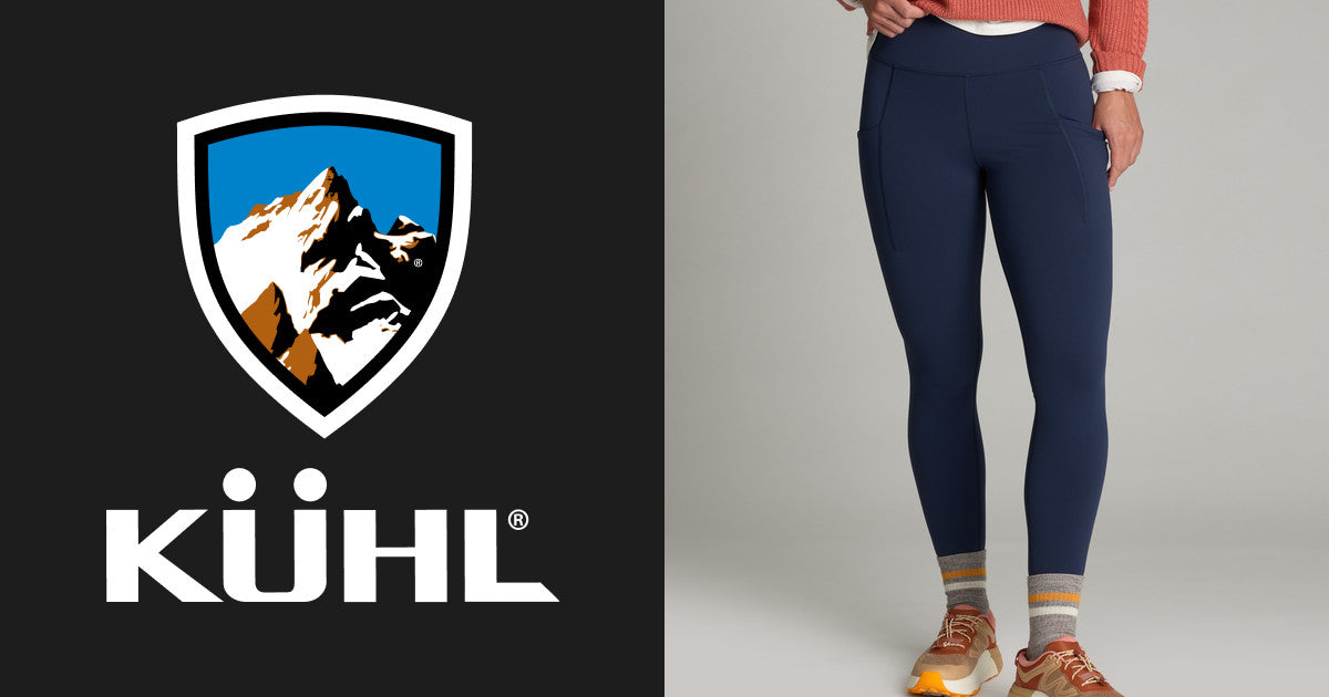 Women's fitted fleece tights in dark navy, front on-model view with side pockets